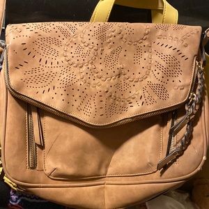 Long strap purse. Used, has the black stain look on the back just from wearing.